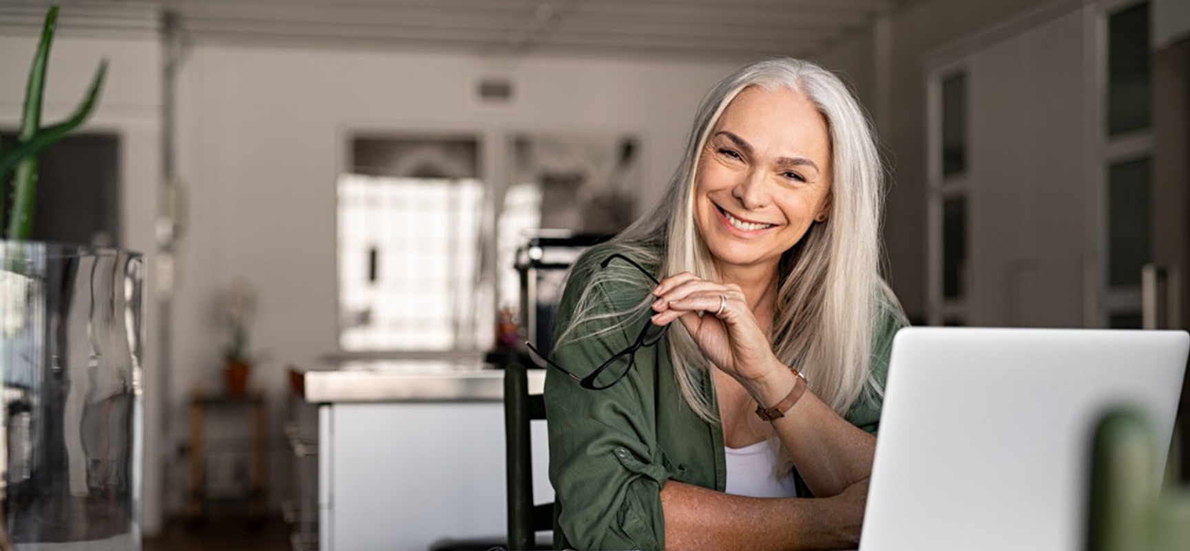 Older Woman with Glasses at Computer