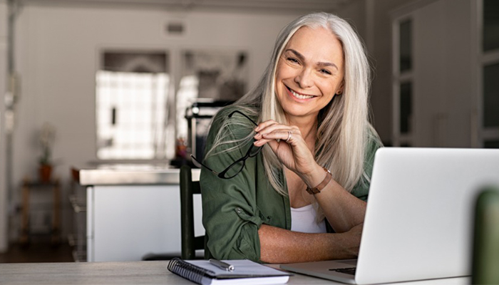 Older Woman with Glasses at Computer