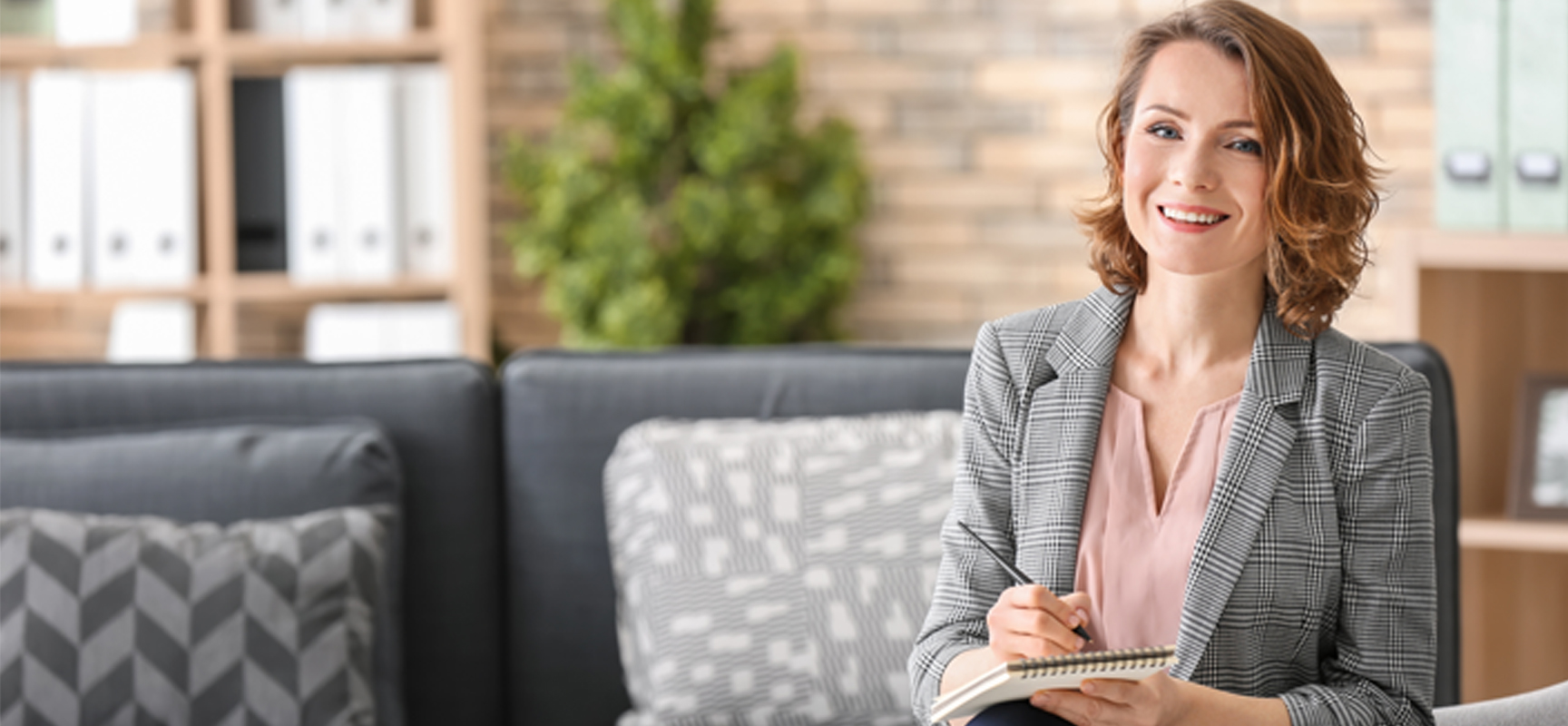 Young Woman on couch planning