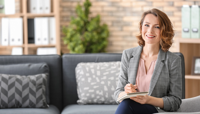 Young Woman on couch planning