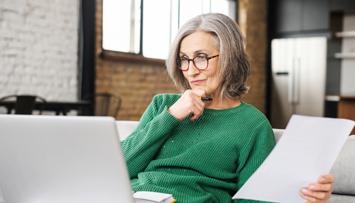 Thinking older woman on couch